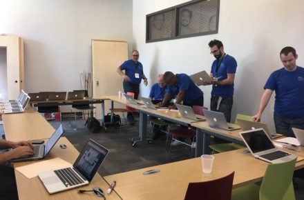 Group of volunteers working on laptops