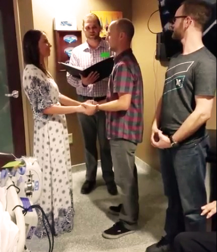 Man and woman exchanging vows in hospital room