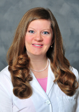 Female doctor wearing white lab coat