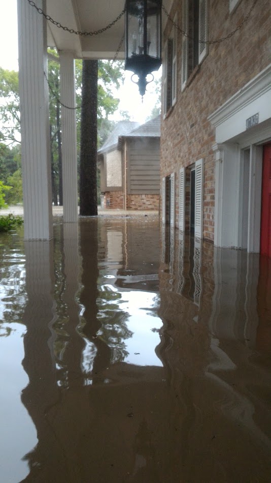 Front porch of house flooded after hurricane