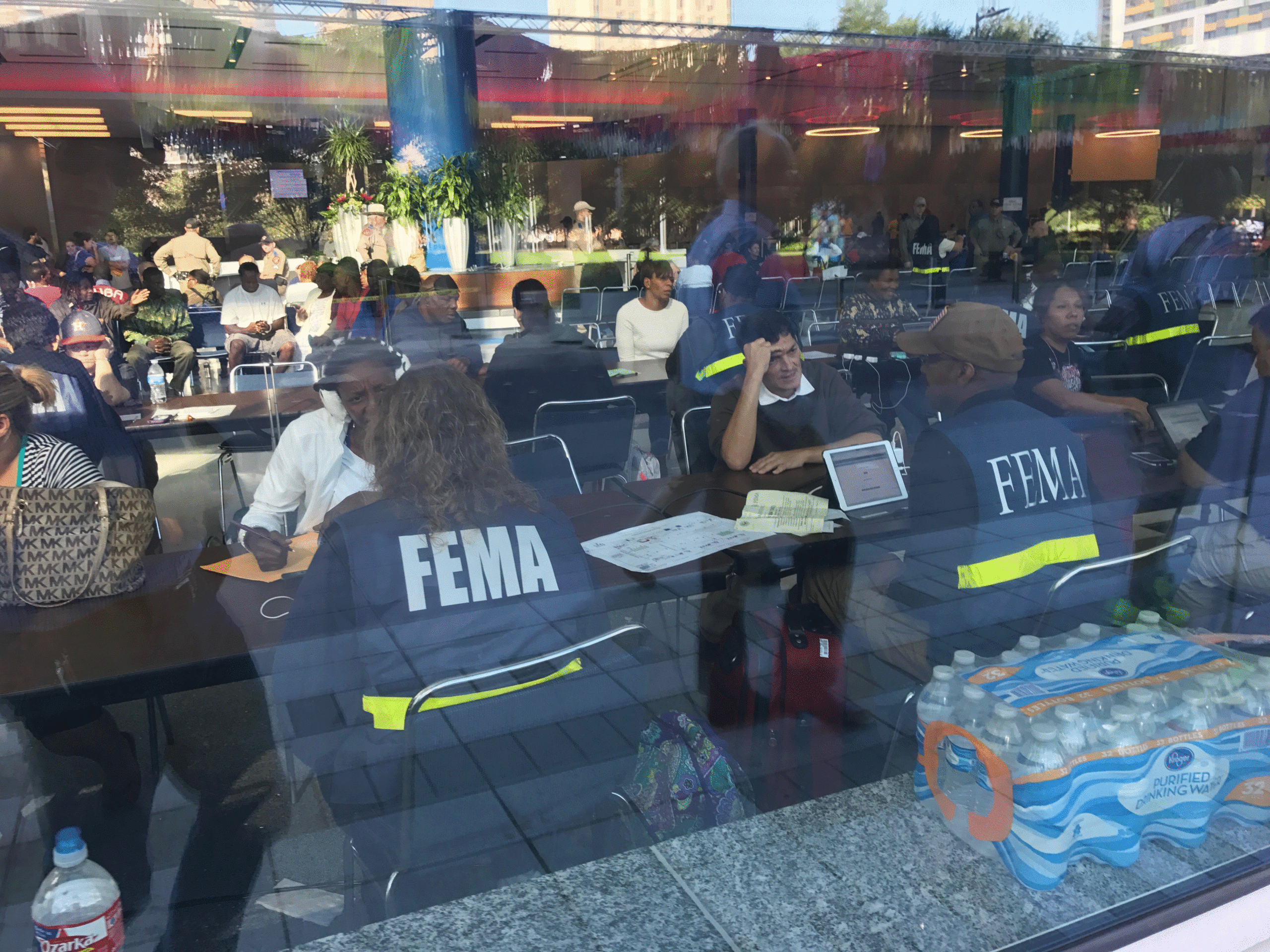 Tables of FEMA personnel meeting with individuals