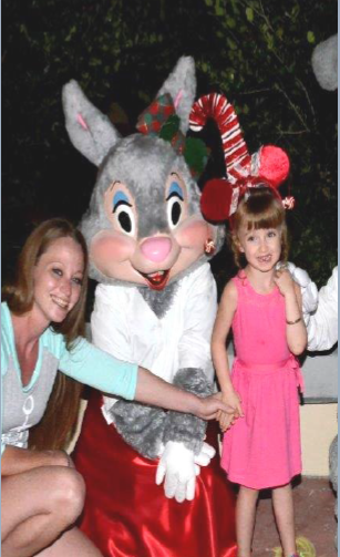 Woman and girl posing with a bunny character