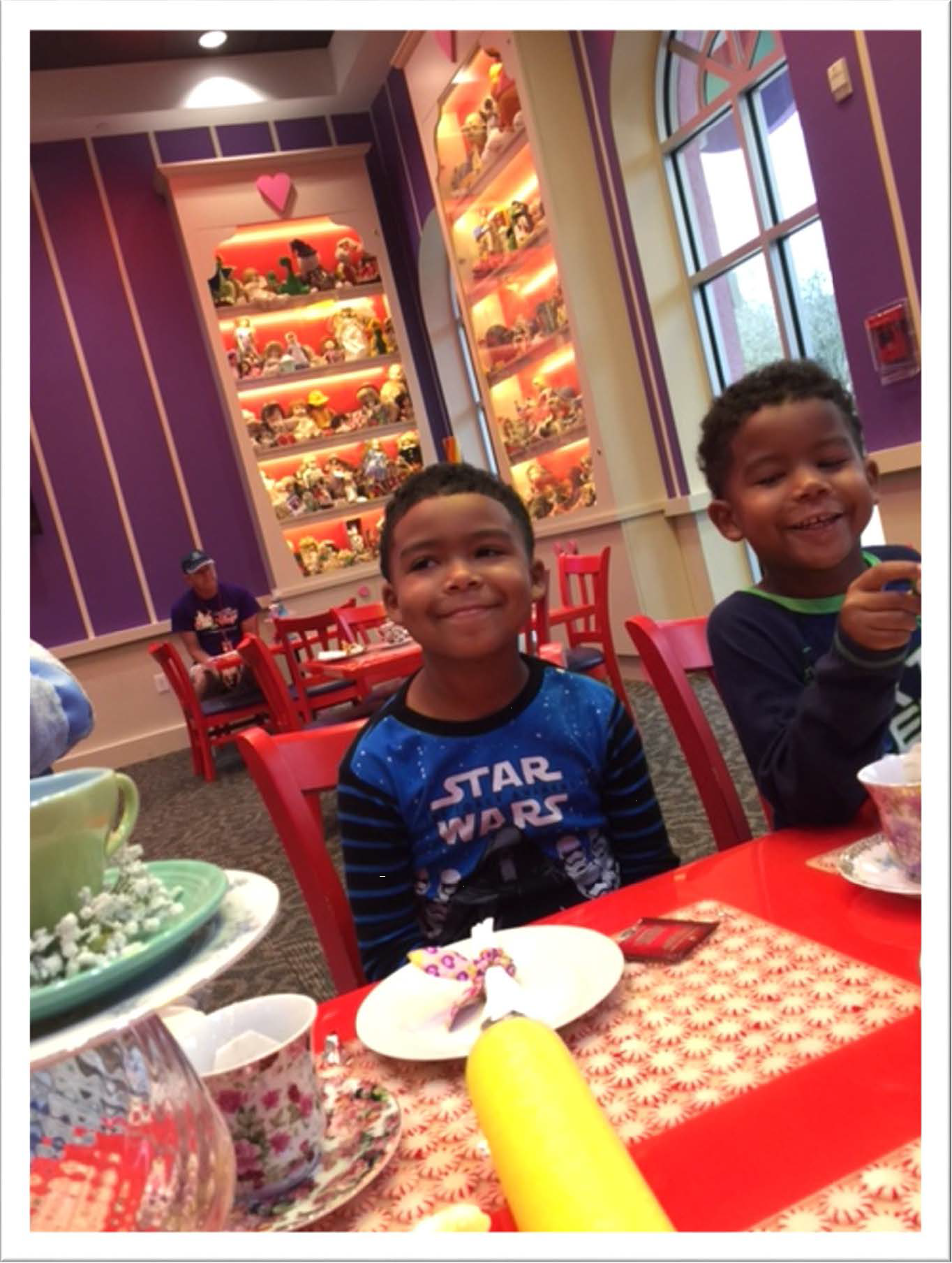 Two boys sitting at a dining table at Disney World