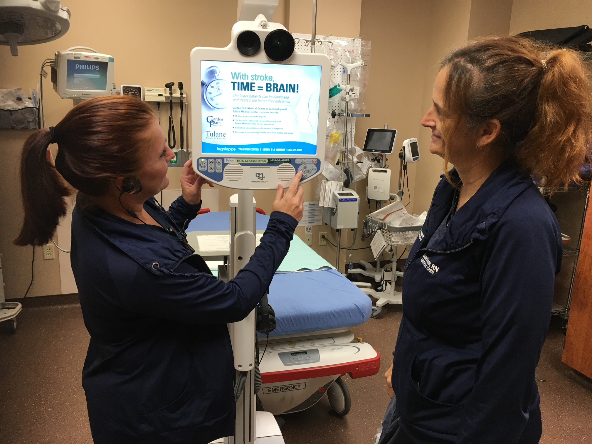 Two female ER caregivers using telestroke robot
