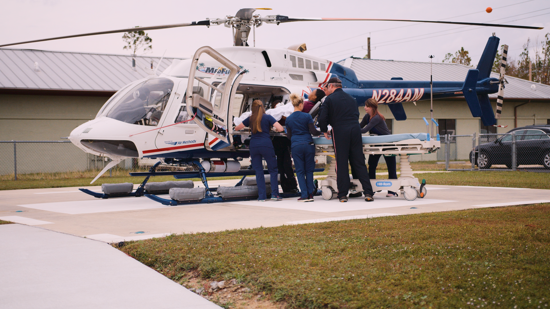 Nurses loading patient into helicopter 