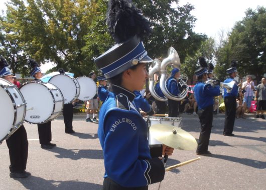 Girl performing in marching band during parade