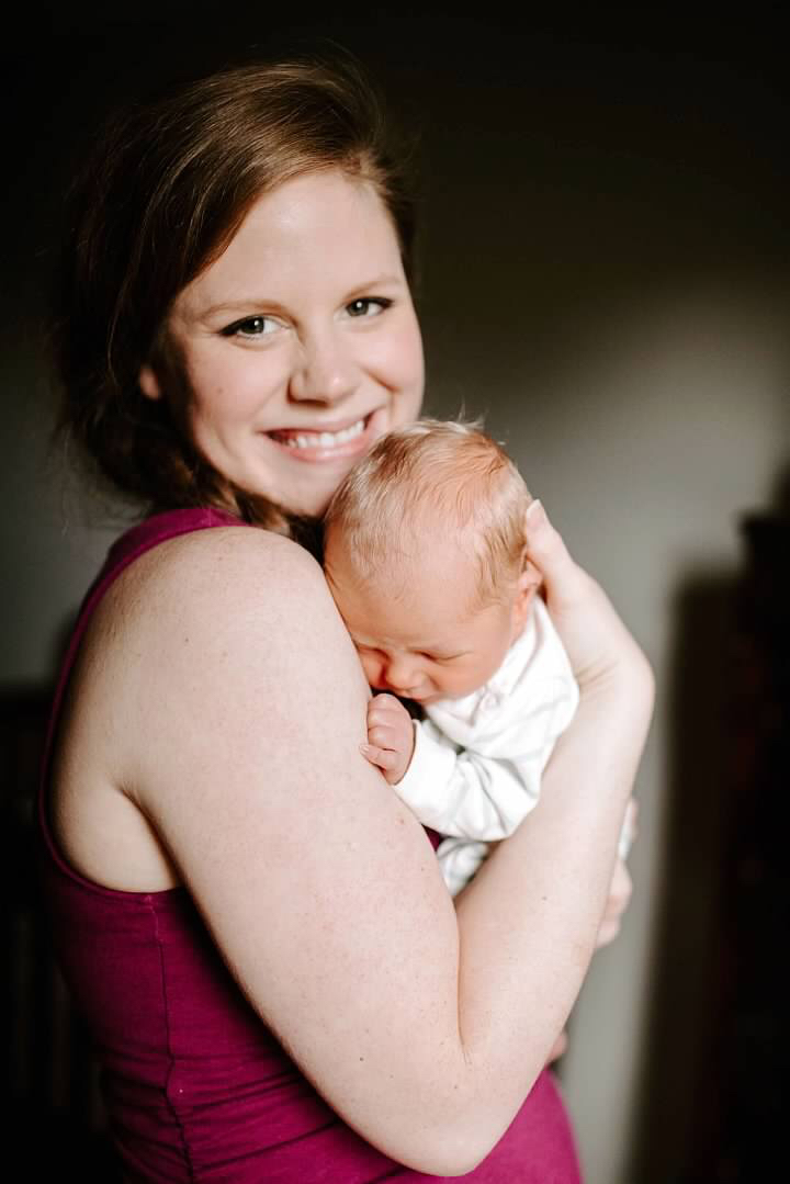 Woman holding baby to her chest