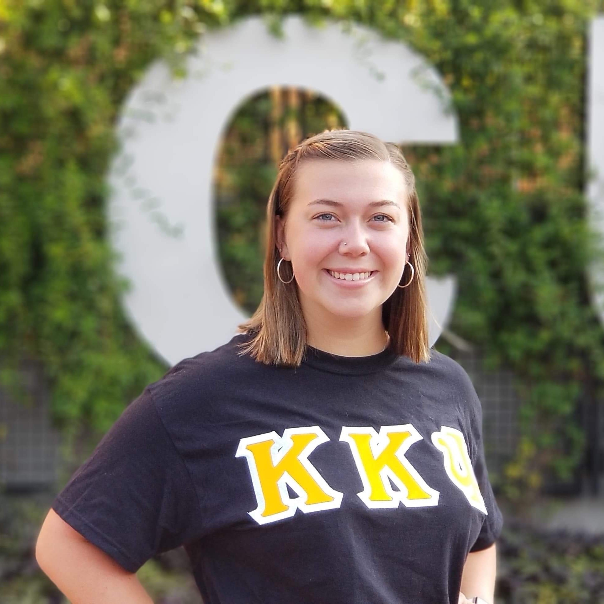 Female college student in sorority t shirt