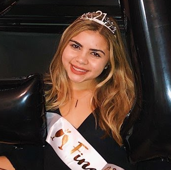Young woman wearing a 21st birthday tiara