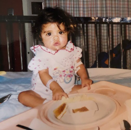 Two year old with a plate of food