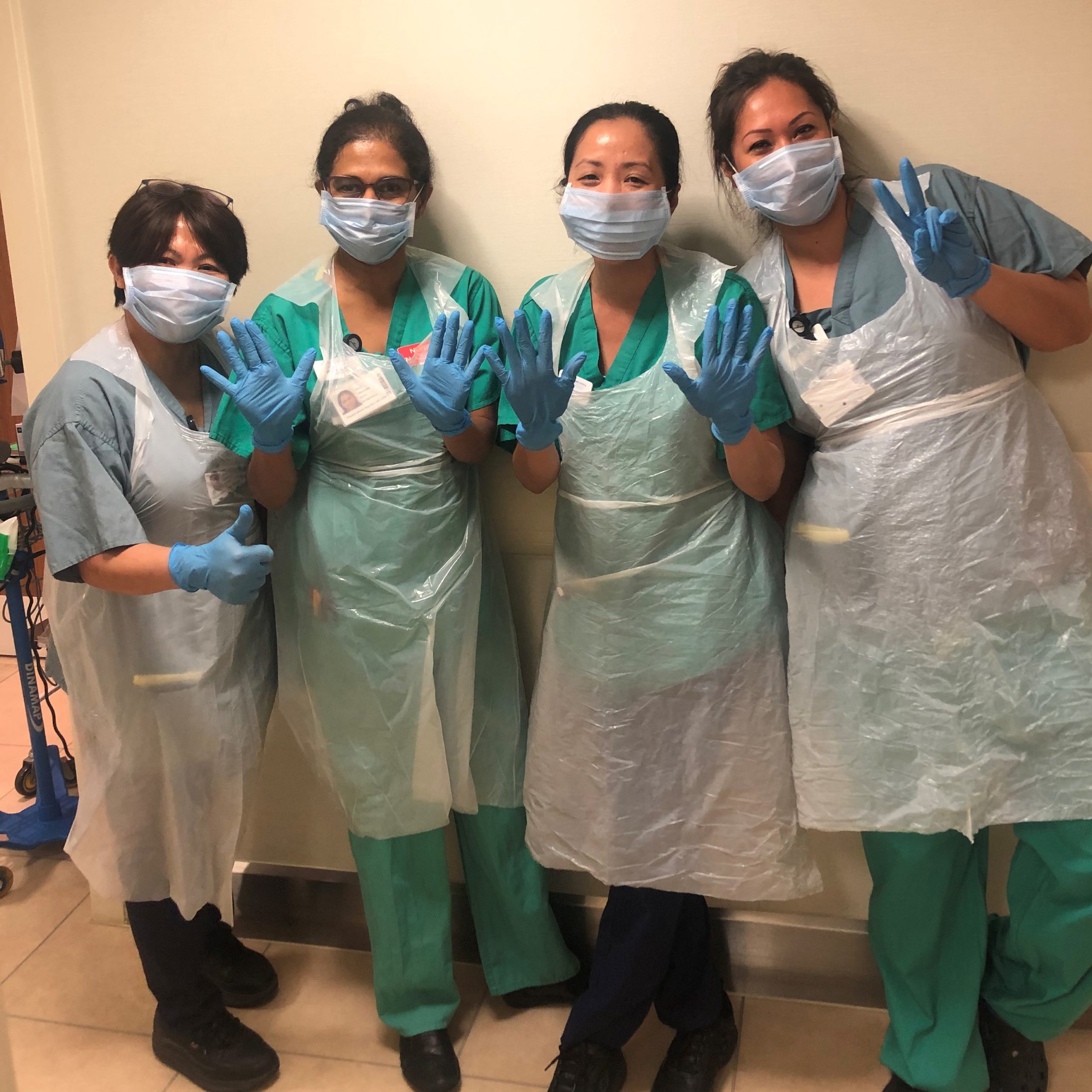 A group of hospital caregivers wearing personal protective equipment