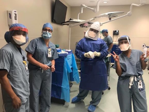 A group of hospital caregivers in an operating room