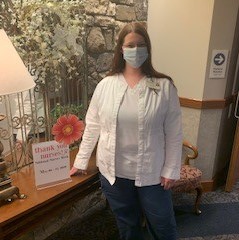 Nurse Beverly Switzer wearing casual clothes and protective face mask 