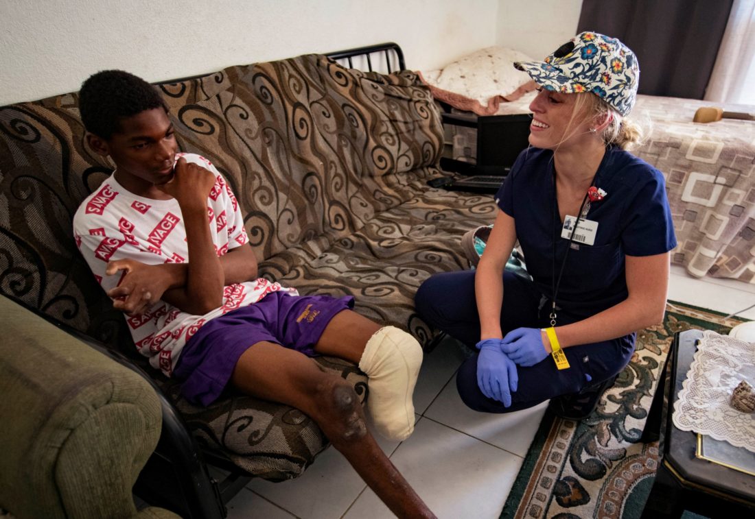 (September 2019) Memorial Hospital Jacksonville nurse Allie Biess collaborated with medical relief team members to address, clean and properly dress 16-year-old Ezequiel's wounds in the Bahamas.