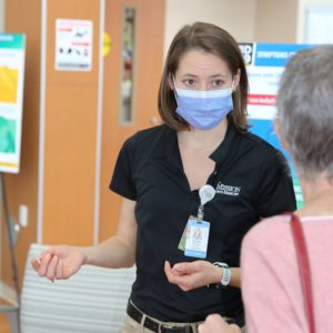 Woman wearing a face mask and black shirt