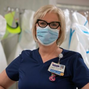 Female nurse wearing a face mask. Headshot of Janeanne Morgan.