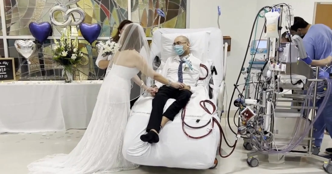Couple exchanging wedding vows in the hospital