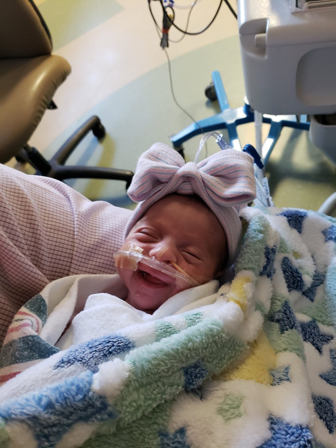Baby in the NICU smiling 