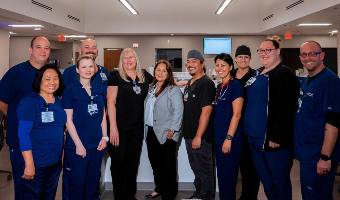 Twelve HCA Florida Healthcare colleagues standing in a Free Standing Emergency Room 