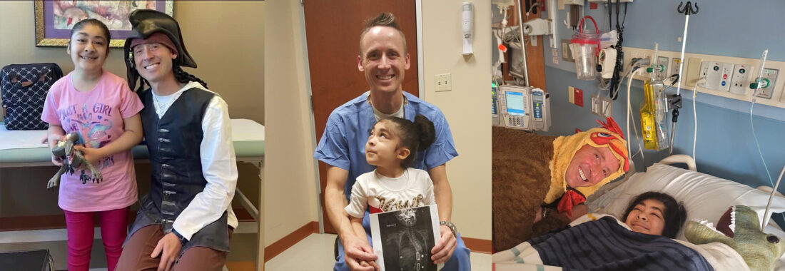 Dr. Jaren Riley dressed in costumes smiling next to young patient, Nellie