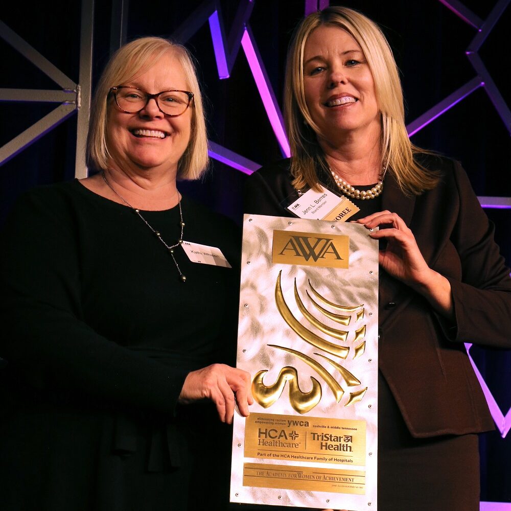 Jen Berres and Kathi Whalen holding an award
