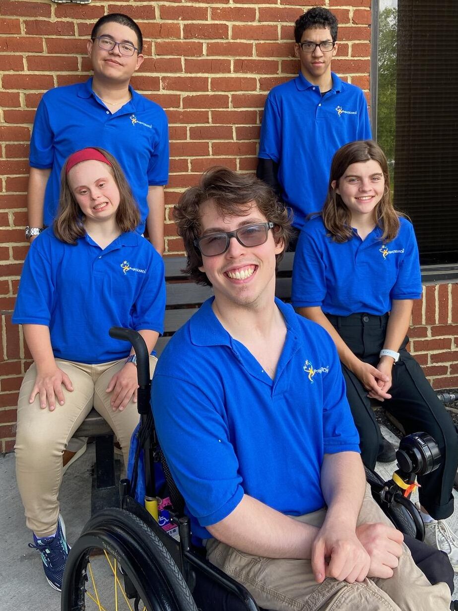 Five Project Search interns wearing blue polos 